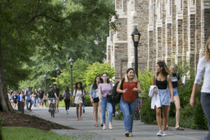 Students walk past Rubenstein Library during class change on the Abele Quad.