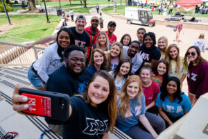 Group of Radford University Students posing for selfie pic on stairs