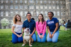 Picture of 4 Georgetown University Students with Jack, the GWU Bulldog Mascot